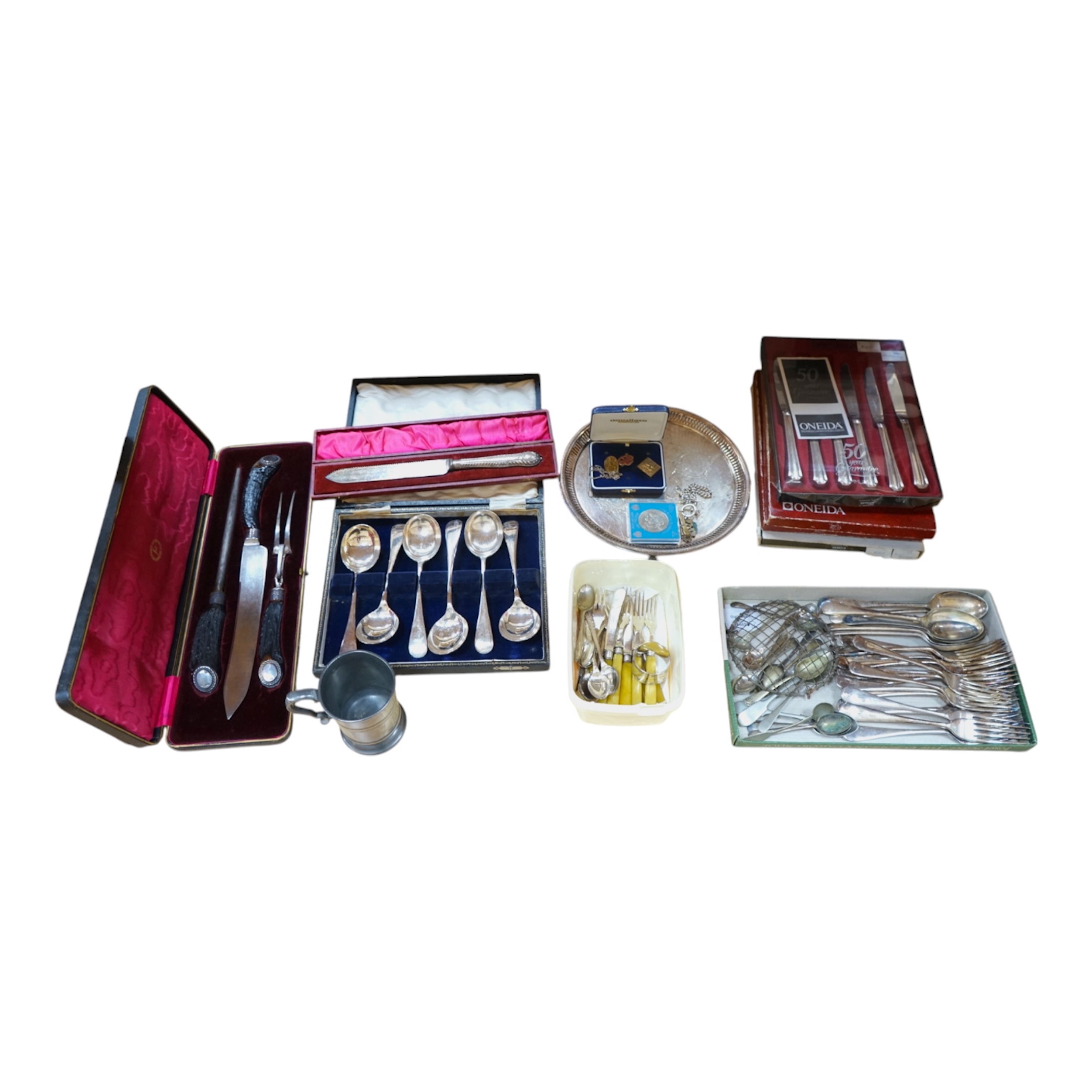 A cased silver mounted and antler handled carving set, plated cutlery, badges, chain, napkin ring etc, carving knife 38cm long. Condition carving set good, the rest variable